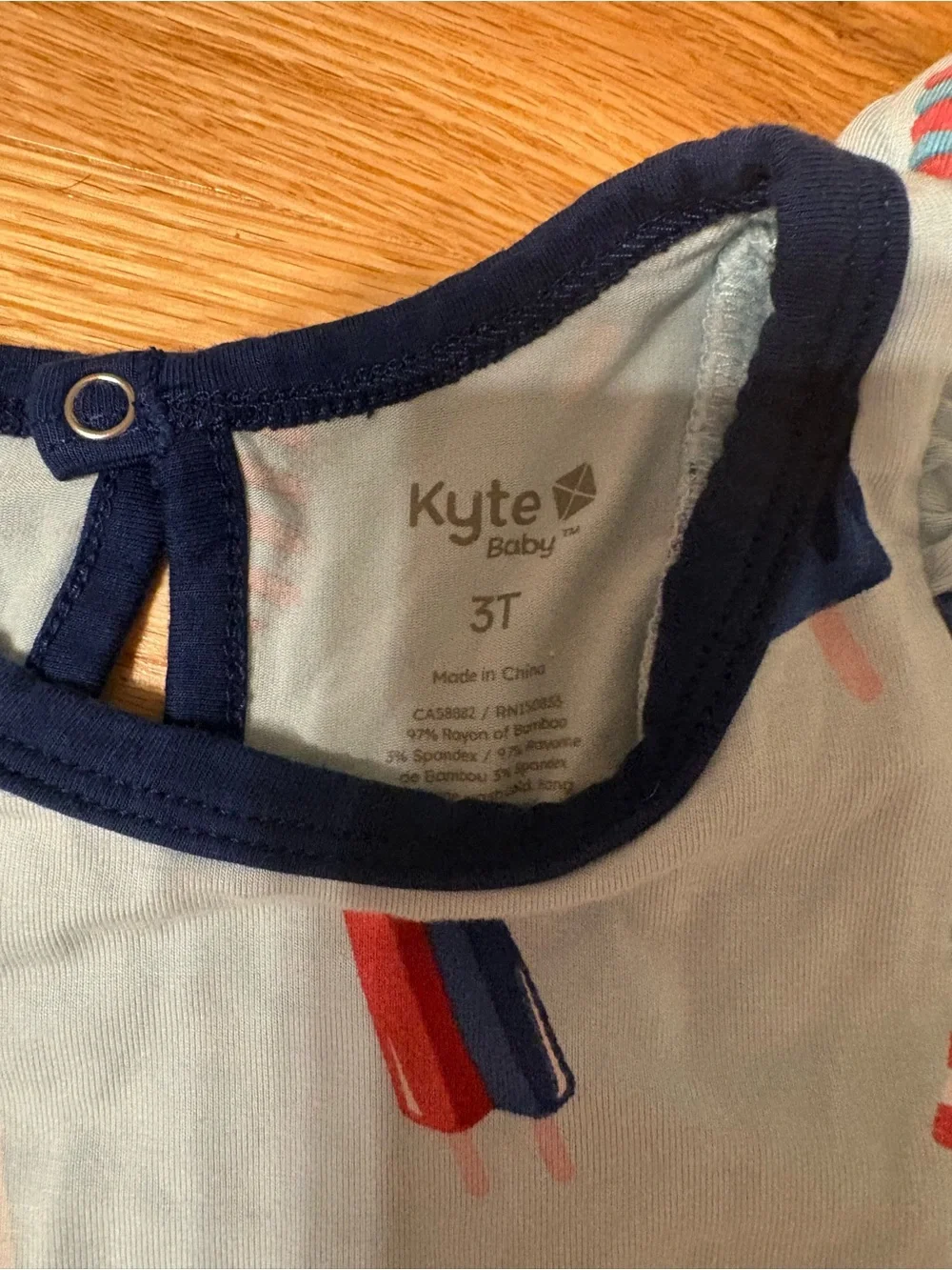 Kyte BABY Light Blue Popsicle Print Sleep Romper with Navy Trim